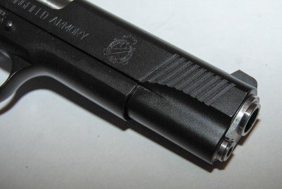 The slide has front and rear cocking serrations.