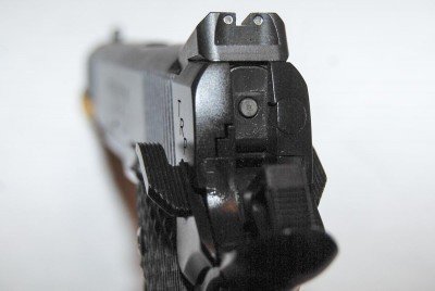 The low-profile combat sights have tritium inserts for night use.