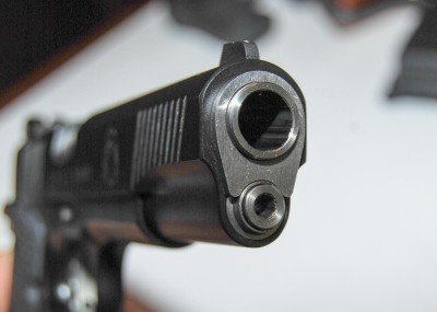 Looking at the business end, you'll see the end of a two-piece guide rod.