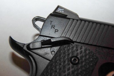 The TRP has ambidextrous safety levers of roughly equal size.