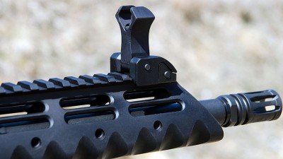 The Diamondhead handguard and flip-up sights are standard equipment. Also shown is the A2 flash hider.