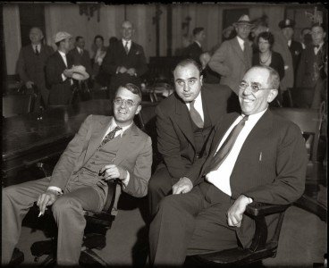 Big Al with his attorneys during his 1931 trial for tax evasion. They were smiling but he went to prison. 