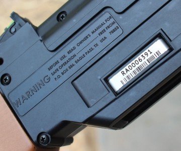 Serial numbers are engarved on a plate secured to the plastic shell.