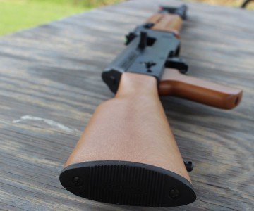 The wooden stock pins into the receiver.