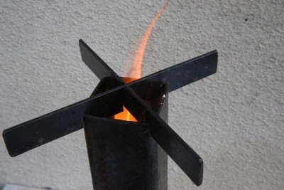 Don't be shy about putting sticks and leaves down the top once you get the fire going and they won't choke it. A raging fire will get you up to temp quick.