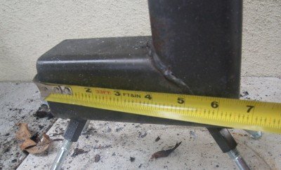 The measurements from the corner on this stove are 6 1/2" wide x 9" tall.  The baffle piece is 5" and has wings that are bent to hold it in. 