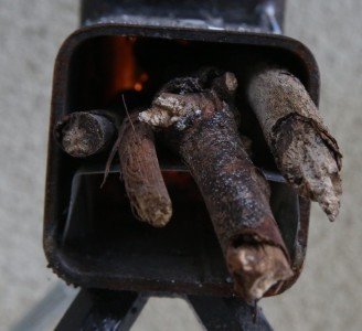 This stove had directions that said use pencil thick sticks. I used a few sizes that fit. 