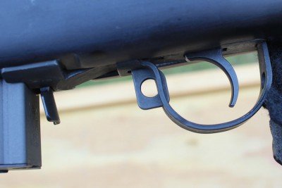 The safety is easy to use. Push forward to fire.