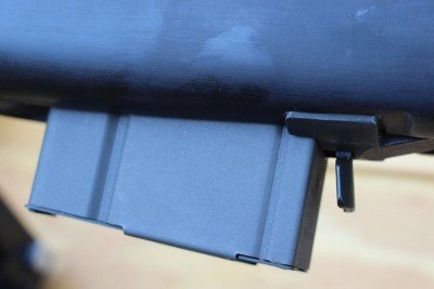 The mag latch releases the gun's hold on the rear catch of the mag, and it rocks free.