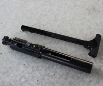 The bolt is a shortened AR-10 style bolt. 