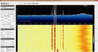 This is a screencap of SDR#. The top display gives you the frequencies, and the bottom is called a waterfall, which I find useless so far. These are the four NOAA weather channel frequencies within reach of my included steel whip antenna. 