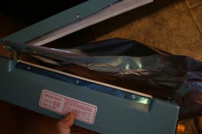 This is the 12" impulse sealer that you can get on Ebay for under $30 with extra heating elements and teflon. Since the bag is 20" wide you have to do it from both sides overlapping, and it works great. 