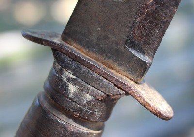 Any idea why the guard is bent back like this--toward the hand?