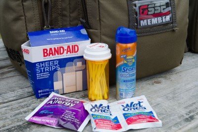 At minimum keep common bandages in your bag. Also considered essential by the author is personal protection from environmental considerations.