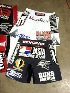 It is irresponsible reporting to say that the UFC and/or UFC fighters are anti-gun. We paid Shane Carwin for this sponsorship WITH GUNS!  Notice that Las Vegas machinegun range The Gun Store is also on the shorts.  Shane is actually an engineer, so he moved on from fighting to a more stable but significantly less glamorous living.  It is absolutely absurd to say that the UFC is just a crude blood sport. It is more real that 99% of what is on TV today. 