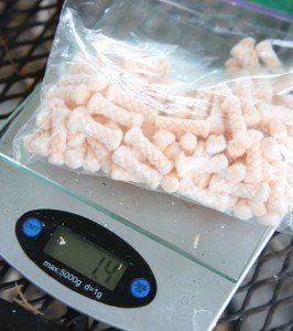 And the winner is...? These Sparklite USGI firestarters are both cheap and light, and they start right up when one spark hits them. They seem to be some sort of light poly rope that they cut up. This is a bag of 100, which is under $20. 