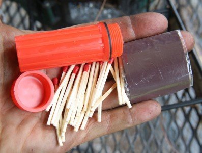 This waterproof matchbox and matches is a buck at Walmart. 