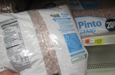 Pinto Beans have 23,310 calories per 20 lb. bag. It costs $13.97 at Walmart.  That equals 1669 calories per dollar.  You should always soak and cook beans well, because it will make them easier to digest. Mixing them with oils also helps. 