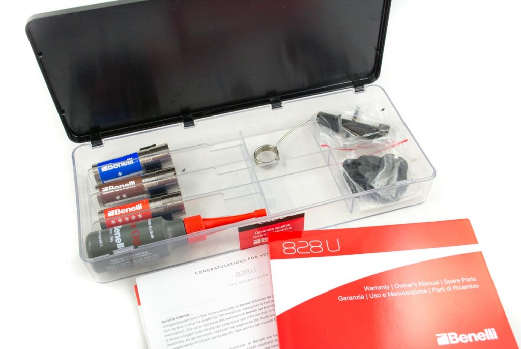 The plastic box inside of the hard case includes extra choke tubes, gun oil, choke wrench, shims and documentation.
