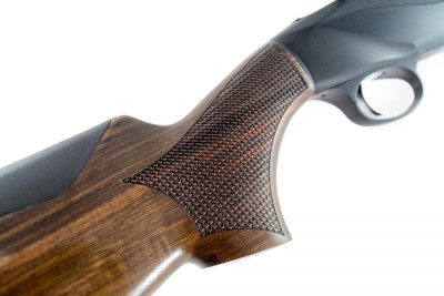 The checkering pattern on the grip and fore-end stock resembles scales - another non-traditional approach. 