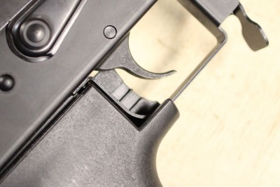 There isn't much travel in the grip itself, but it is enough to pull the trigger and allow it to reset.