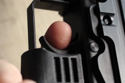 push forward and you the trigger pulls on the finger (which here is not resting on the shelf like it should be).