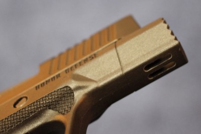 The bottom of the fist. It sticks out like the lip on a bulldog.