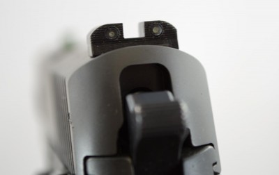 The rear sights are noticeably smaller than the front to minimize confusion in the dark and speed front sight acquisition.