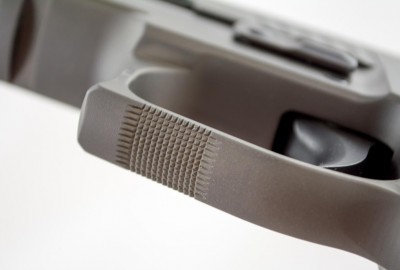 Checking has been added to the bottom of the trigger guard to help keep the support hand in place.