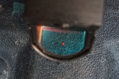 One glowing red dot is easier to see than three white dots. 