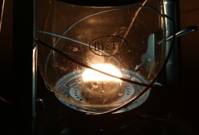 The heart of your lighting plan should be some kind of kerosene lantern.  They start at about $7 each, and top out around $100. This is a $50 Dietz Jupiter with a 7/8" wick. 
