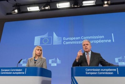 Internal Market and Industry Commissioner Elżbieta Bieńkowska, on the left and Migration, Home Affairs and Citizenship Commissioner Dimitris Avramopoulos, on the right who said about the gun-control package, "The adoption of the firearms package today is proof of the Commission's determination to address the new reality we are confronted with. We need to remove regulatory divergences across the EU by imposing stricter, harmonised EU standards for firearms and ensuring efficient exchange of information between Member States."