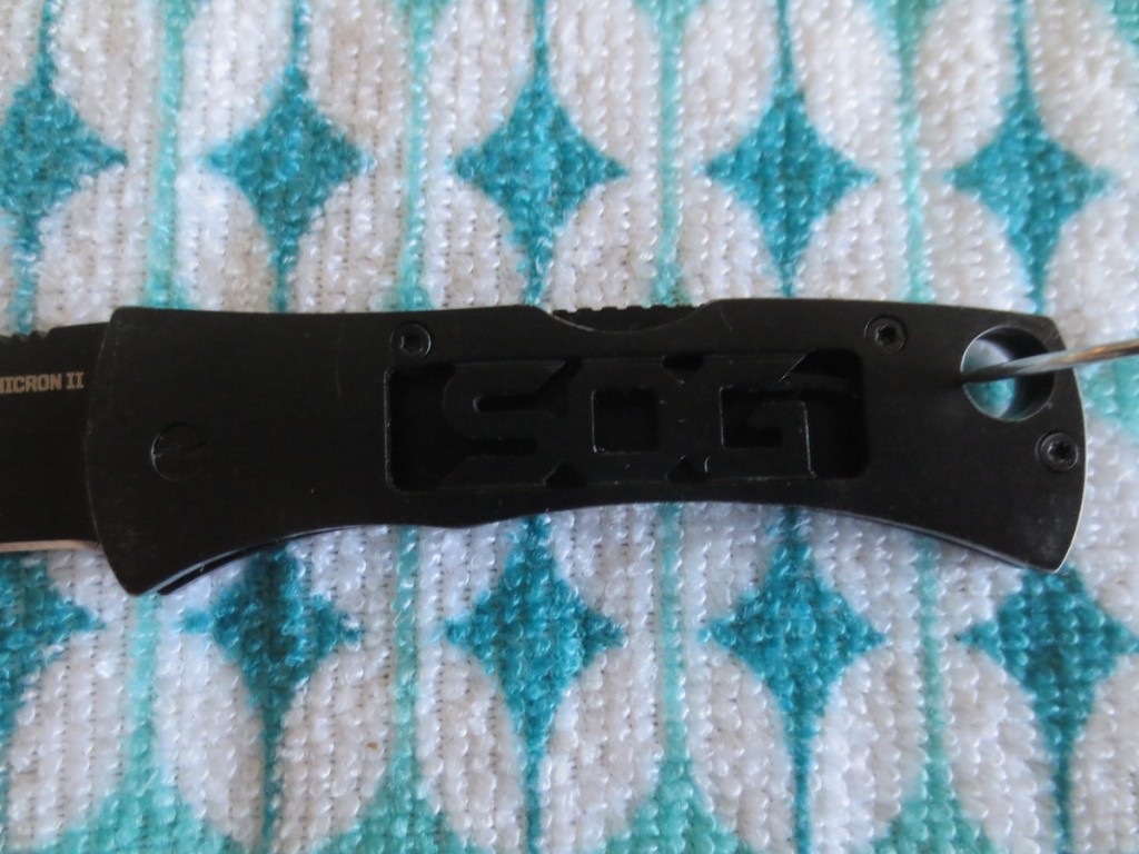 "SOG" skeletonized in the handle.  Not a big fan of it, but whatever.  
