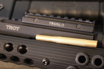 Troy Takes on the AK-47 If it doesn't slide in place, you may need to find a way to hammer it home. I used a brass punch and a Tru-Glo sight riser.