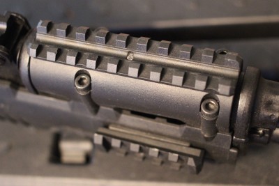Troy Takes on the AK-47 The benefit is clear. My old rail was plastic, which is much less stable than the aluminum.
