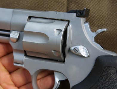 The big revolver has two cylinder lock releases. 