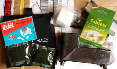 I would also include an alcohol stove if you can. Walmart has  Esbit type stoves for cheap, and this black stove is on Ebay for like $30. It is a backpackers rocket stove  and comes with solid fuel and can also burn sticks. 