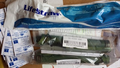Lifestraws are now on Ebay for like ten bucks each as military surplus. You might want to think about putting some of them and water purification tabs in your bucket. 