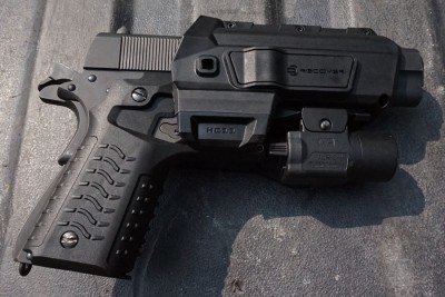 The HC11 holster with retention. You can use any light with this combo.