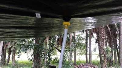 A drain tarp has a built in spigot for the water to escape. Generally they are threaded for a garden hose. 