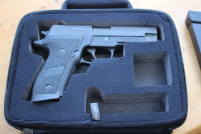 Bigger case, bigger gun. This P226 is a bit of a stretch for the case, mostly because it has extended mag-well grips.