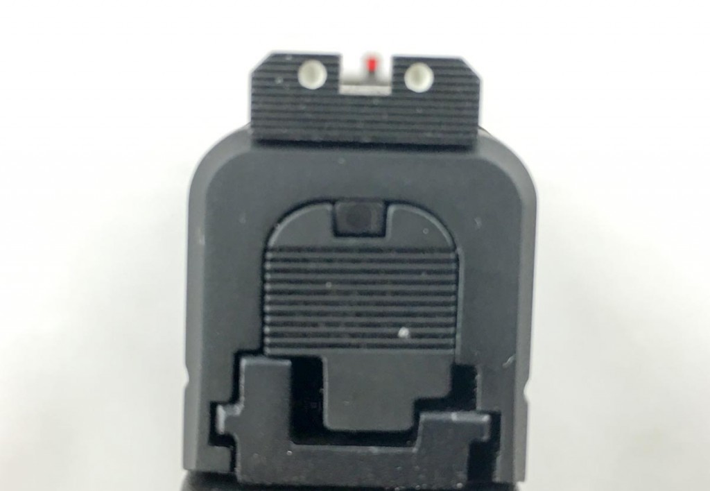 The rear sight is serrated to minimize glare in the sight picture.