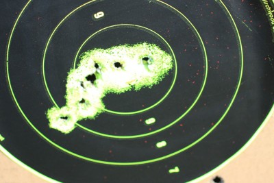 7 Rounds with iron sights from 25 yards. 