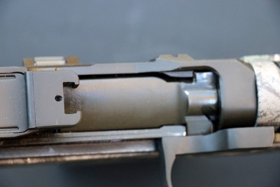Or tradtitional scopes can be mounted to the top of the receiver with the help of an adapter.