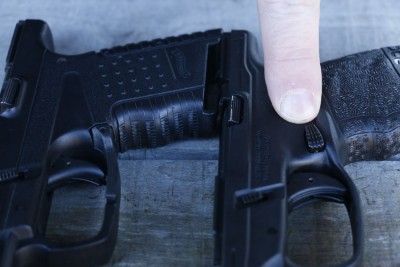 The magazine button is textured and easy to reach. It is protected from accidental activation by a swell in the grip.