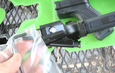 The kit comes with its own screw that you need to replace your larger headed grip screw with. 