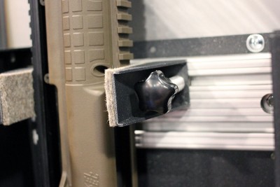 Inside of the second generation, there's a track system with sliding panels that will hold guns securely.