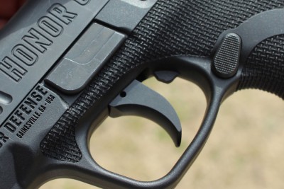 The texture wraps the frame and extends above the trigger guard. 