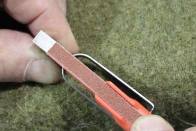 Material being removed from top of trigger.