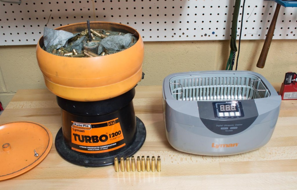 However you do it, with a dry tumbler or liquid method like the Lyman ultrasonic cleaner on the right, be sure to clean the loose dirt from your brass before reloading. It doesn't have to be shiny, just clean.